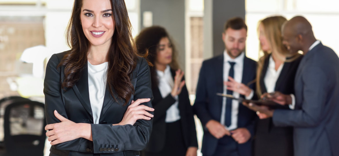 Businesswoman leader in modern office with businesspeople workin