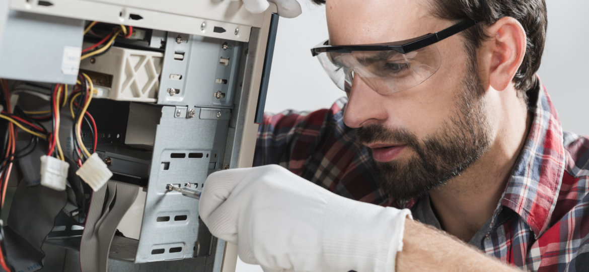 man-repairing-cpu-with-screwdriver