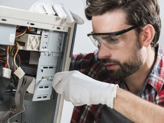 man-repairing-cpu-with-screwdriver