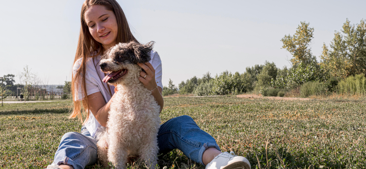 full-shot-smiley-woman-petting-dog